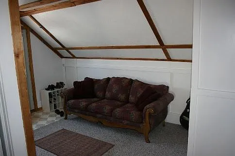 Living Room. Carpet was replaced with Luxury Vinyl plank in May 2024.