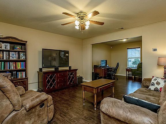 This spacious family room welcomes you in the door.