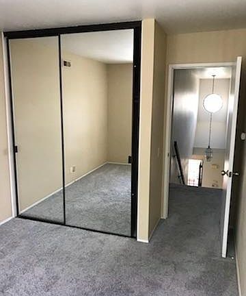 Secondary bedroom with mirrored doors