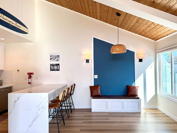 Beautiful open kitchen with dining, and a built-in bench to maximize dining seating!