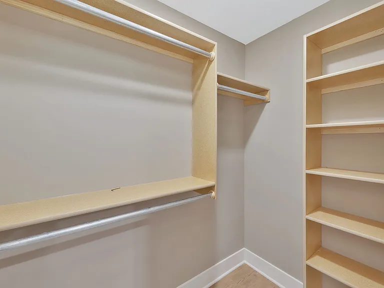 walk in closet for bedroom in basement