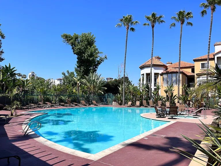 Resort style heated pool, adjacent to club house, gym, and mailbox