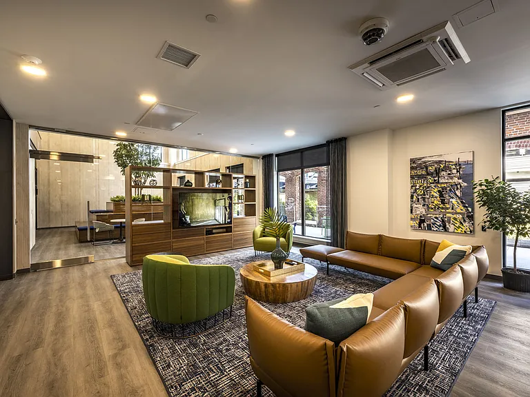 Resident Lounge - Seating Area With Couch And Chairs Facing Tv.