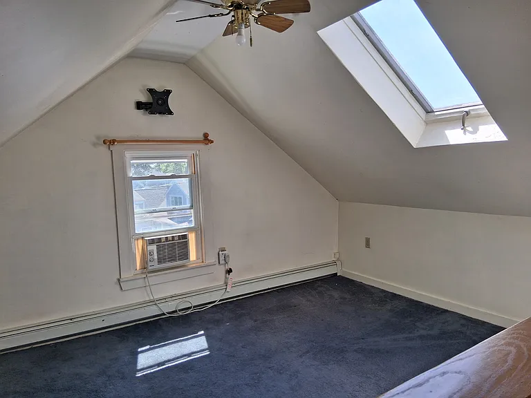 Bonus room. Could be 2nd living room (one separate living area for each roommate?) TV room or home office. On 3rd floor.