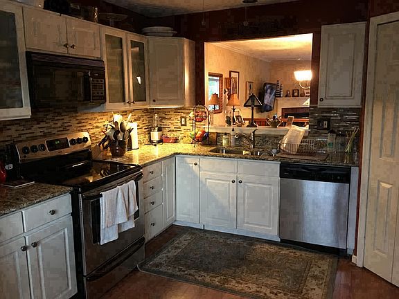 Kitchen with stainless steel appliances and granite counters