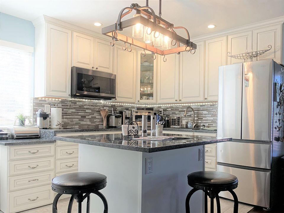 Updated kitchen with a complete line of appliances.