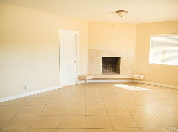 The First Unit living room w/ Fireplace.