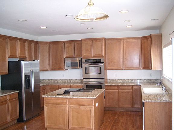 Gourmet kitchen with granite countertops stainless steel appliances