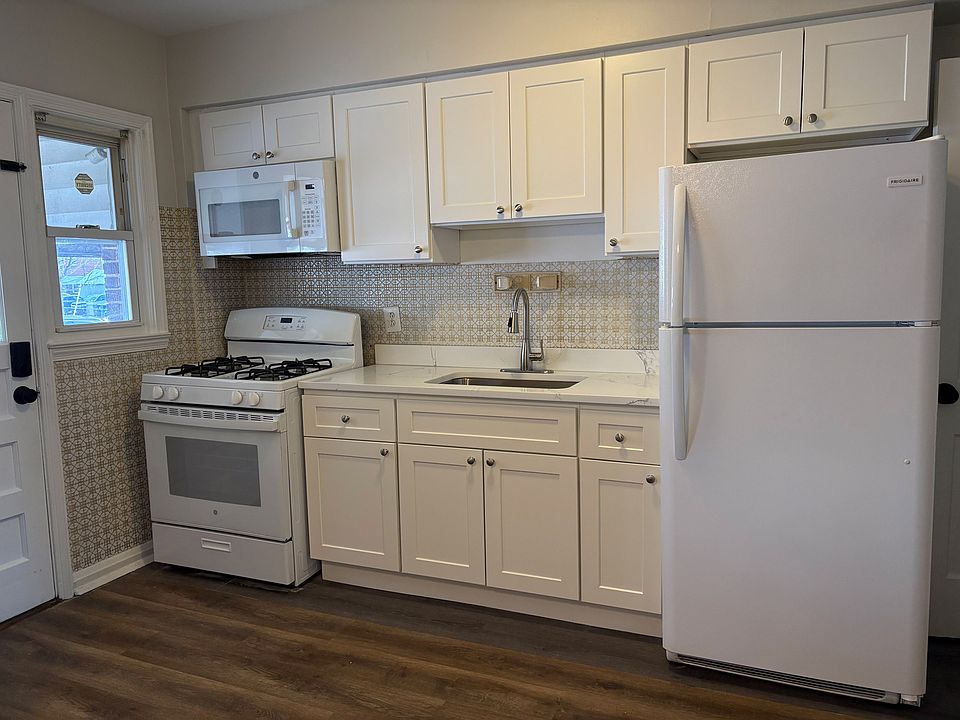 Brand new kitchen! New cabinets, quartz countertop, range and microwave!