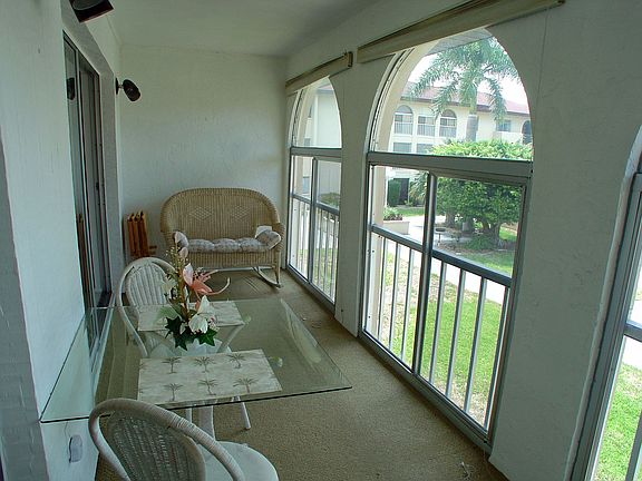 Lanai with screens and sliding vinyl doors