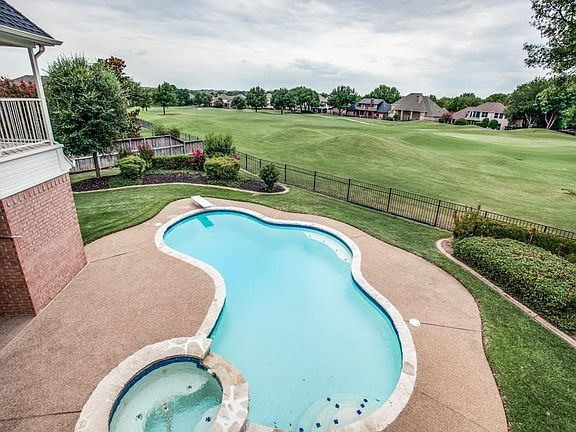 This could be your view from large wrap around  upstairs balcony!  14th fairway and green on Golf Club Fossil Creek!