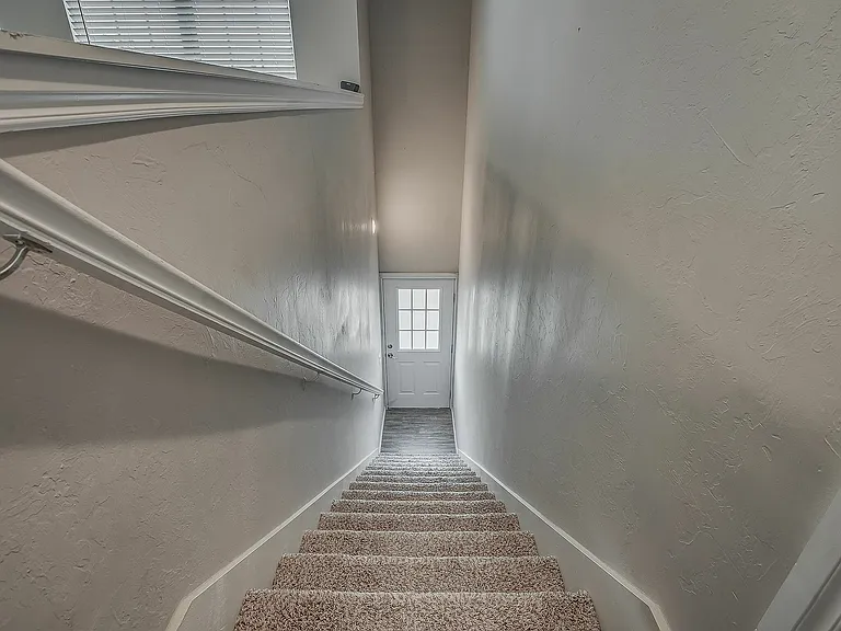 Welcome home with this airy and inviting staircase entrance.