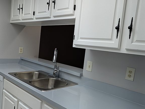 The kitchen boasts a very clean, sleek look.