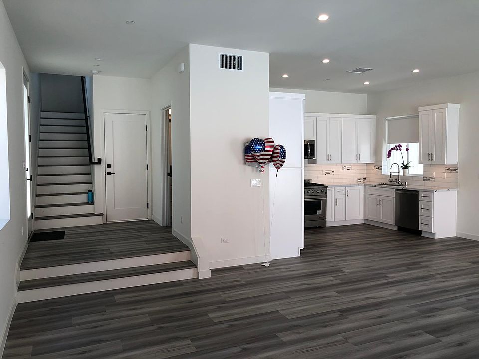 unit 418 open floor plan from living room area panoramic pic taken. Waterproof floors fridge dishwasher micro great stove and oven stainless. Look fabulous