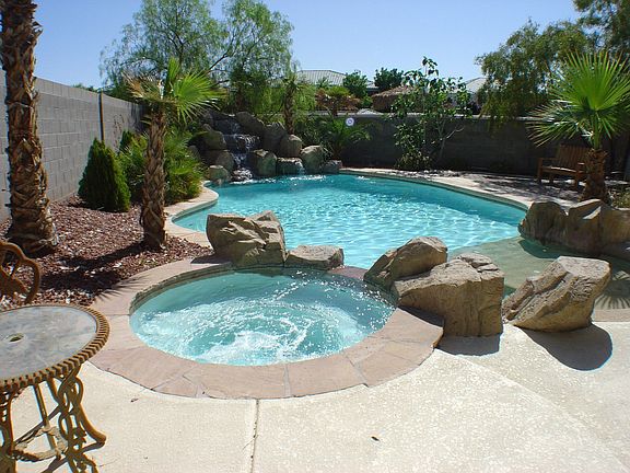 Heated Pool with Custom Waterfall and Jetted Spa