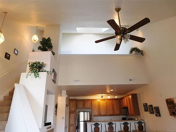 Open living room with 2-story vaulted ceiling