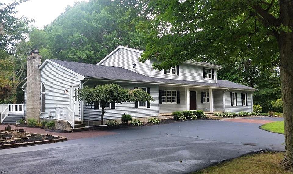Front view - Circular blacktop drive - Private side entrance - Large front porch