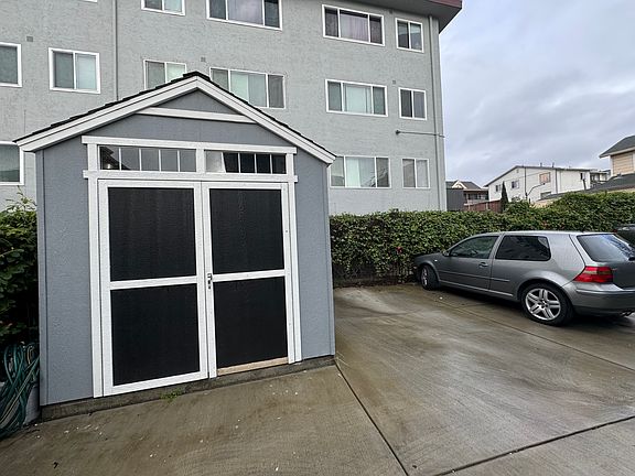 Shed and parking area on the backside of the building