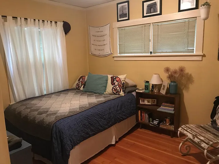Bedroom 1, wood floors, built-in drawers in closet