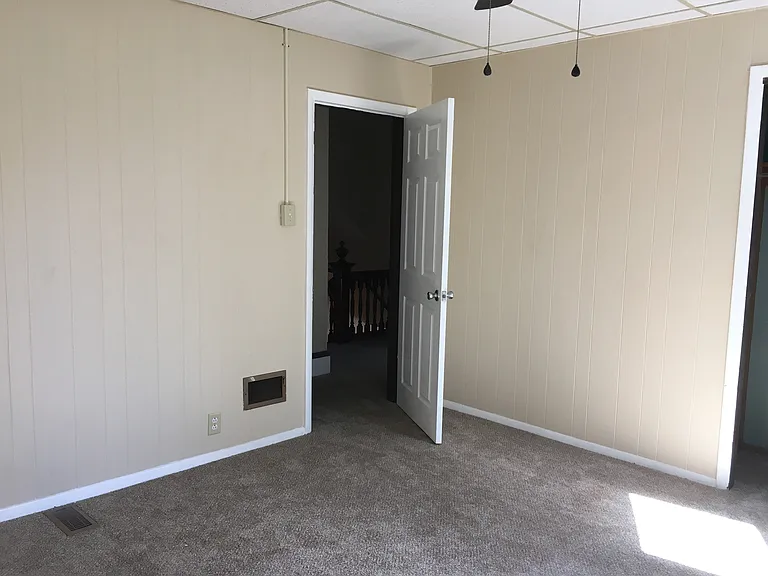 Middle bedroom facing yard.
