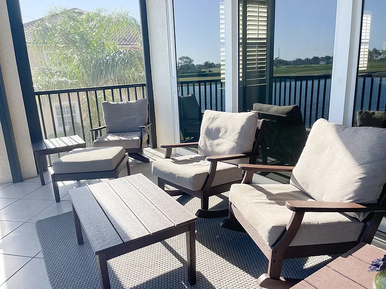 Private Lanai with panoramic screening overlooking 18th green of the Mustang Course at Lely Resort