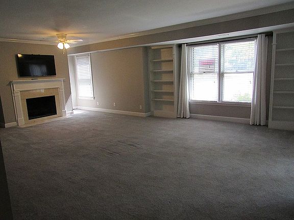 LR w fireplace & bookshelves