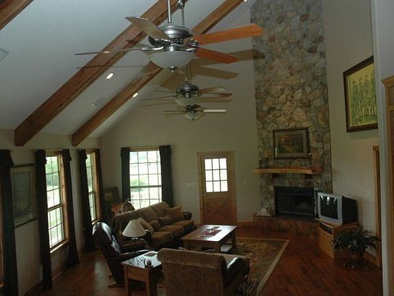 Rock fireplace, ceilings soar 25 ft.