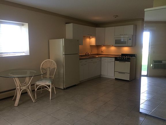 Kitchen prior to renovation and new appliances.