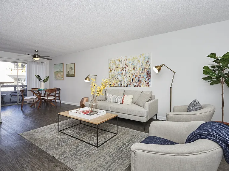 Living Area and Dining Area Looking Out Onto Balcony