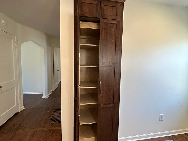 Pantry provides extra storage space for kitchen or household items.