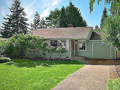 Front of house, large front yard and driveway