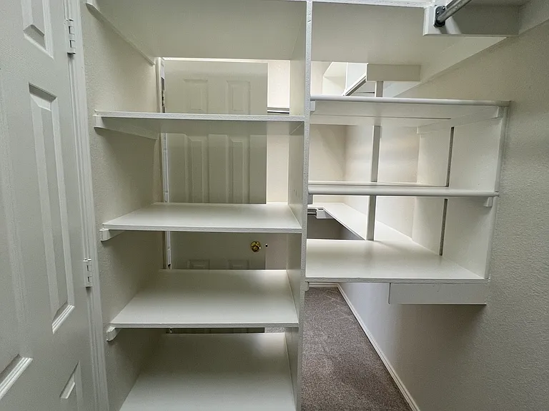 Built in shelving in master closets