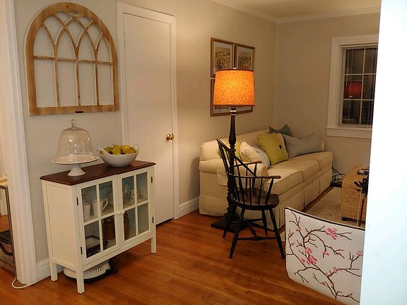 The door in the living room is a coat closet.