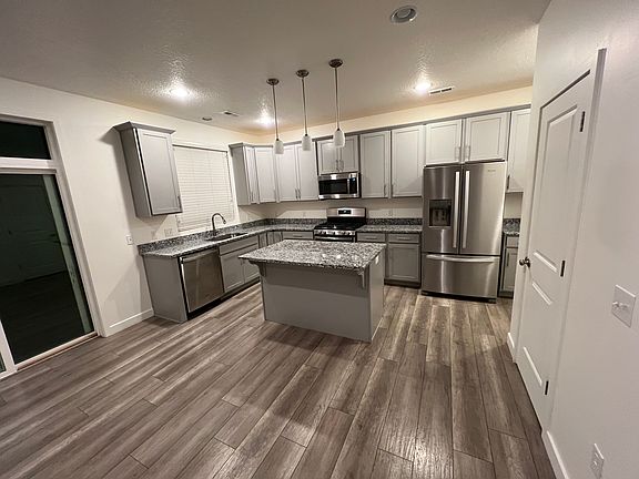 Kitchen includes new appliances and a walk-in pantry.