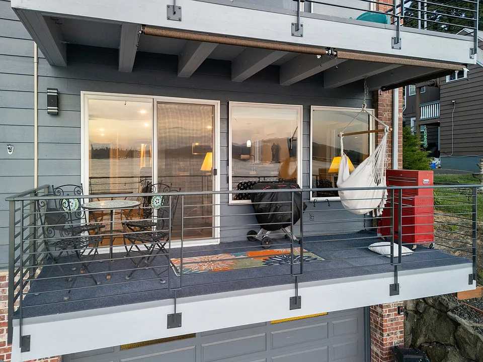 Updated deck has Geco covering and custom steel railings.