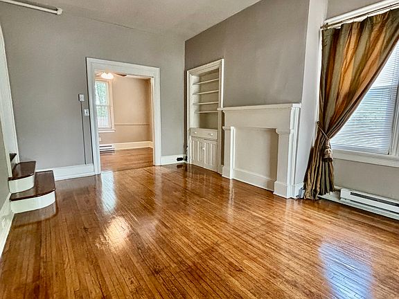Livingroom with built in's and Custom made Drapes (if you like).