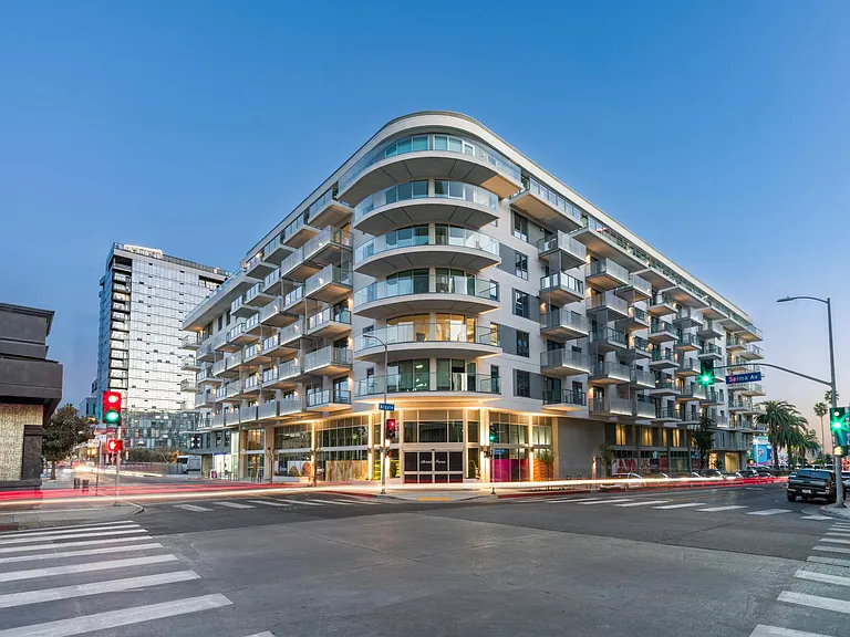 A rooftop deck boasting sweeping views of the Hollywood sign and surrounding Hollywood Hills enhances the overall appeal of the community.