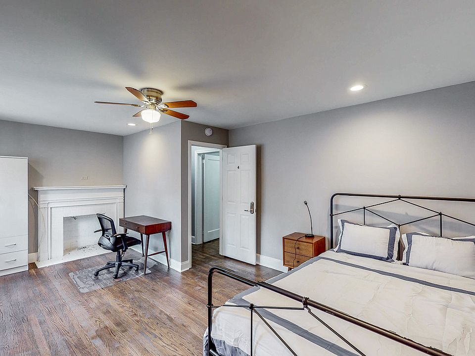 Additional room amenities include a desk, chair, ceiling fan, and private entrance.
