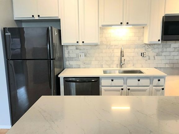 NEW Quarts Counters and Marble Backsplash in the kitchen