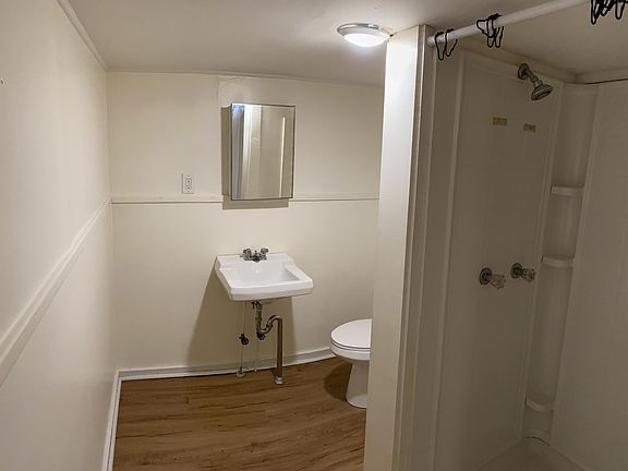 Bathroom with stall shower.