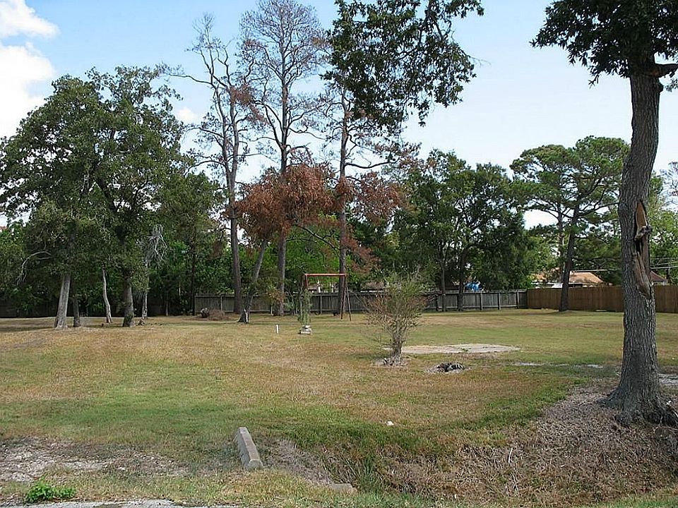 LOT FEATURES 2 CULVERTED DRIVEWAYS & IS FENCED ON 3 SIDES