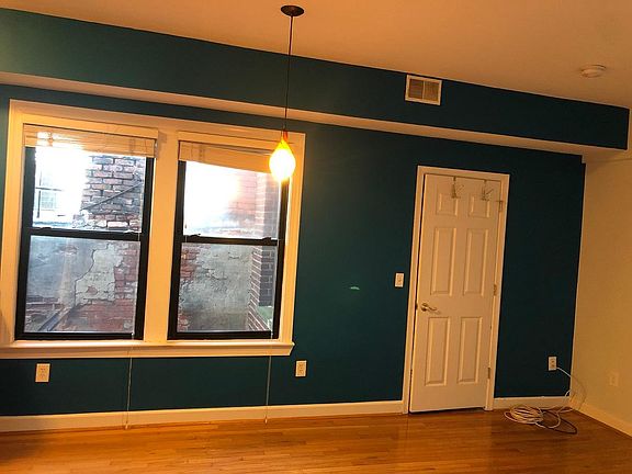 Living room windows and bedroom door. Looking east.