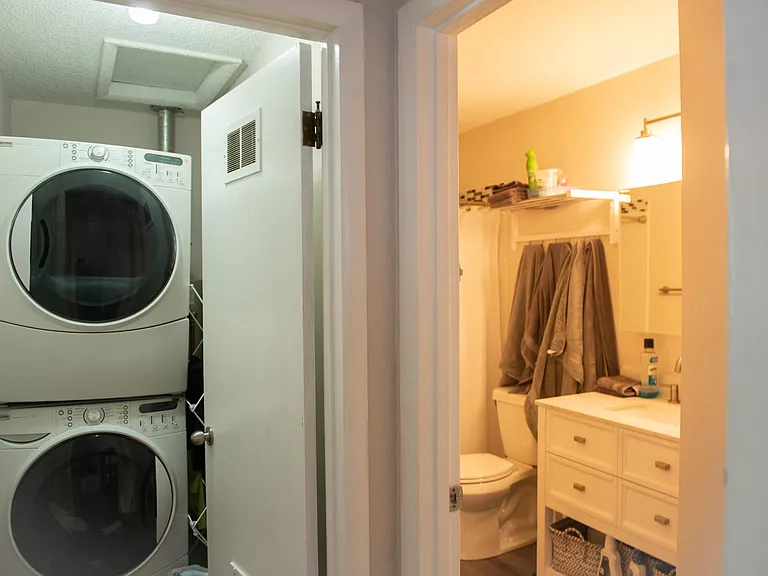 All new bathroom with tiled shower and bathtub, In-unit laundry in separate area