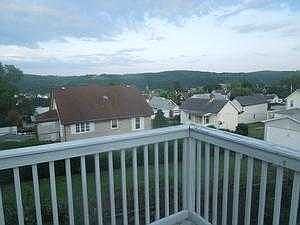view of upper deck in rear of home