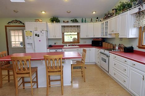 Kitchen has laminate flooring.