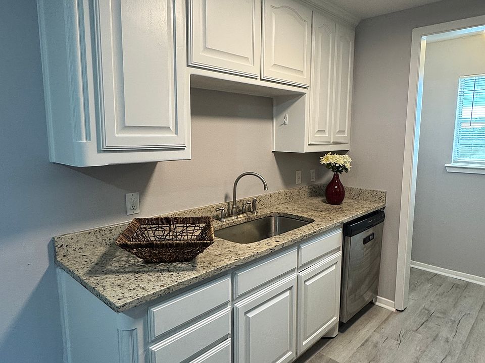 Granite counter tops. Newly painted cabinets. New stove. Oversized under mount kitchen sink.