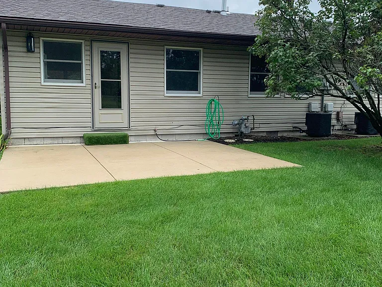 Private concrete back patio.
