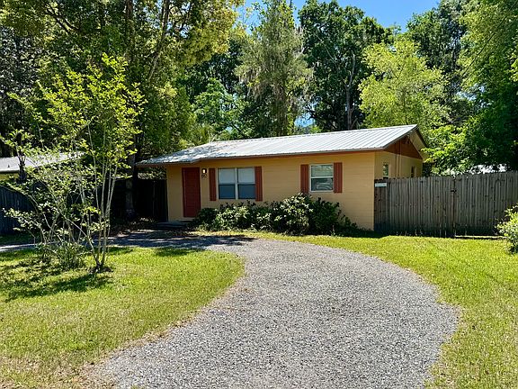 Front view of house and circular driveway