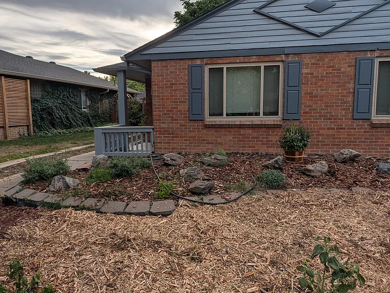 Added new plants and mulch. The front yard is now xeriscaped to make maintenance easier.