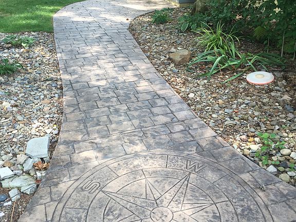 Front Yard and stamped concrete walkway , also includes larg